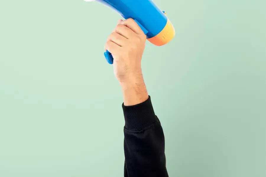 A hand holding a loudspeaker to broadcast news