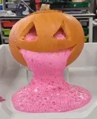 Carved Pumpkin with potion pouring out of its mouth  