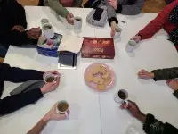 Hands holding coffee mugs  