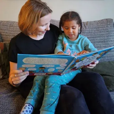 Mother and daughter reading a book